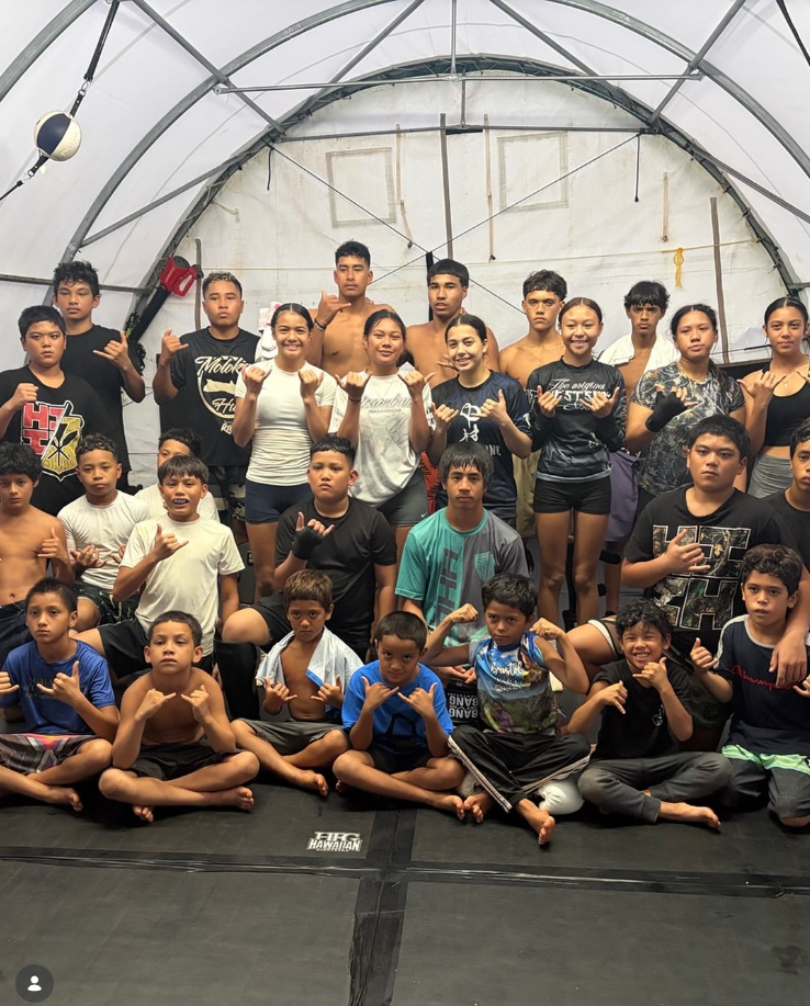 Youth boxer training with coach