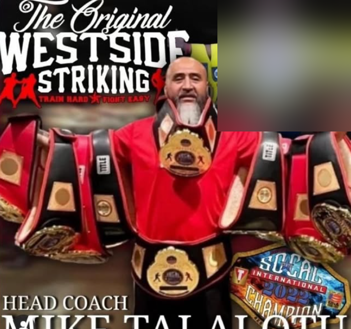 Coach Mike Talalotu with championship belts